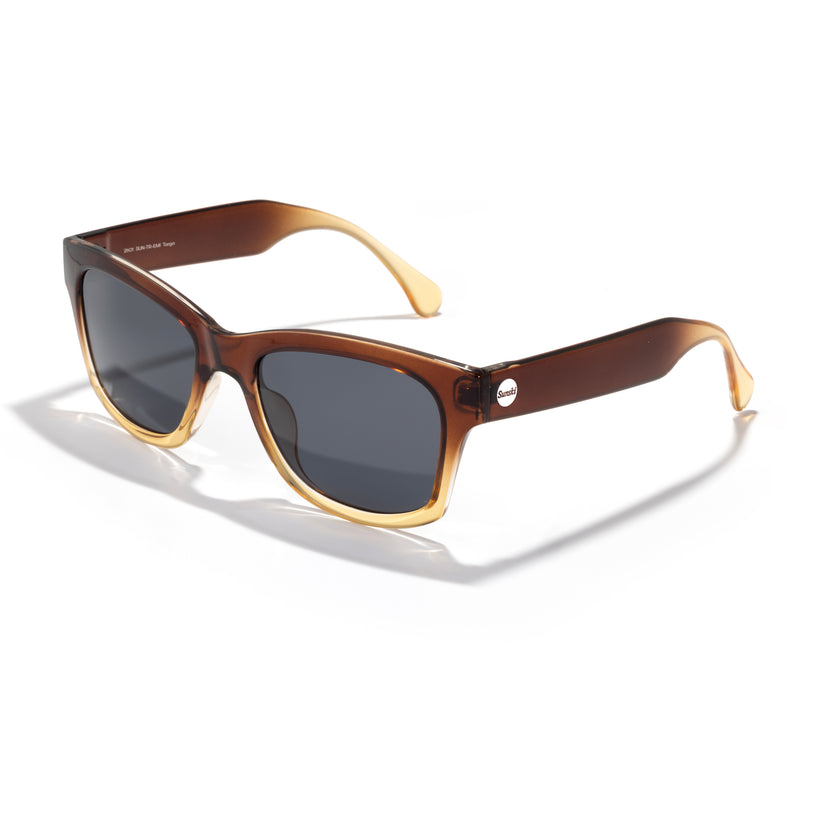 Brown sunglasses with gold frame on a white background