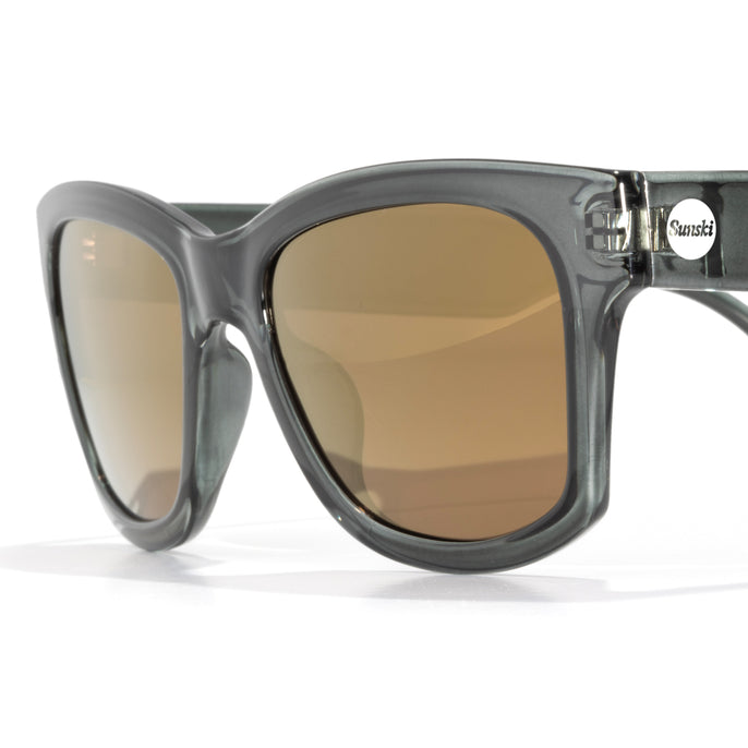 Sunglasses with brown lenses and gray frame on a white background