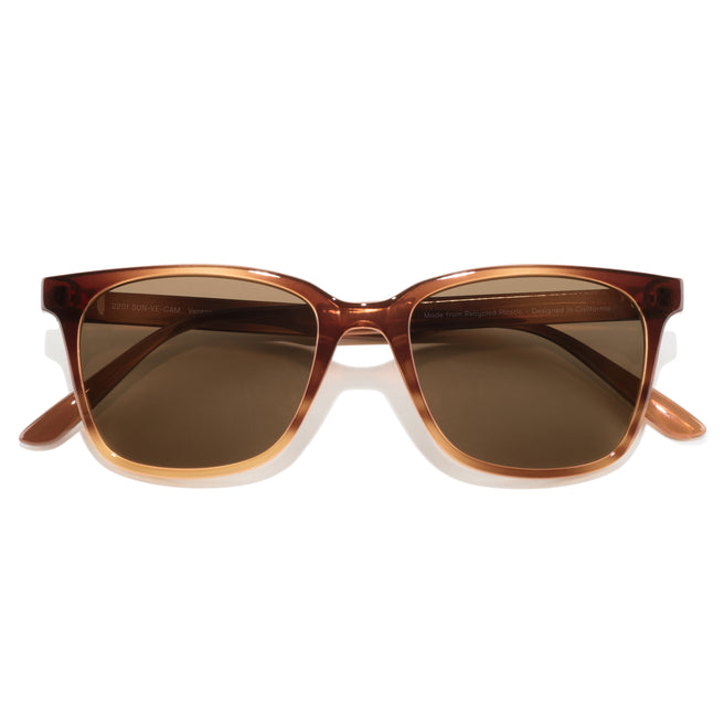 Brown sunglasses with a reflective surface on a white background