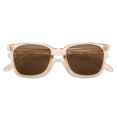 Sunglasses with a beige frame and brown lenses on a white background
