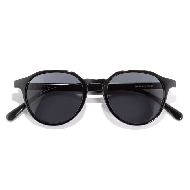 Black sunglasses with dark lenses on a white background
