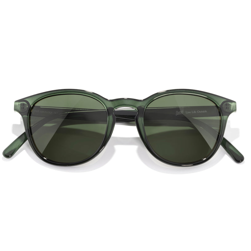 Green sunglasses with a white background