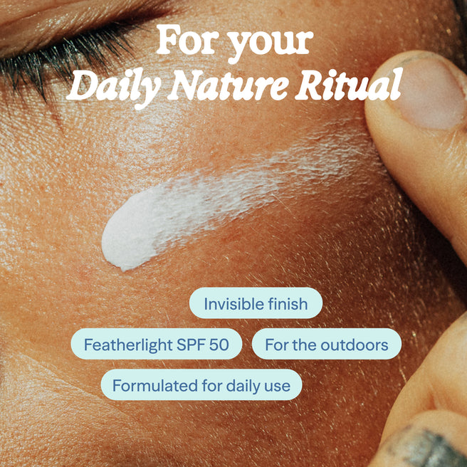 Close-up of skin with sunscreen application and text about daily nature ritual, invisible finish, featherlight SPF 50, for the outdoors, and daily use.