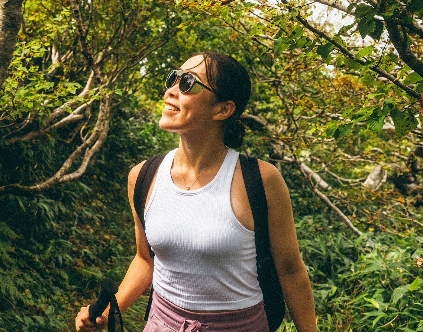 woman in sunski strada sand amber in the forest