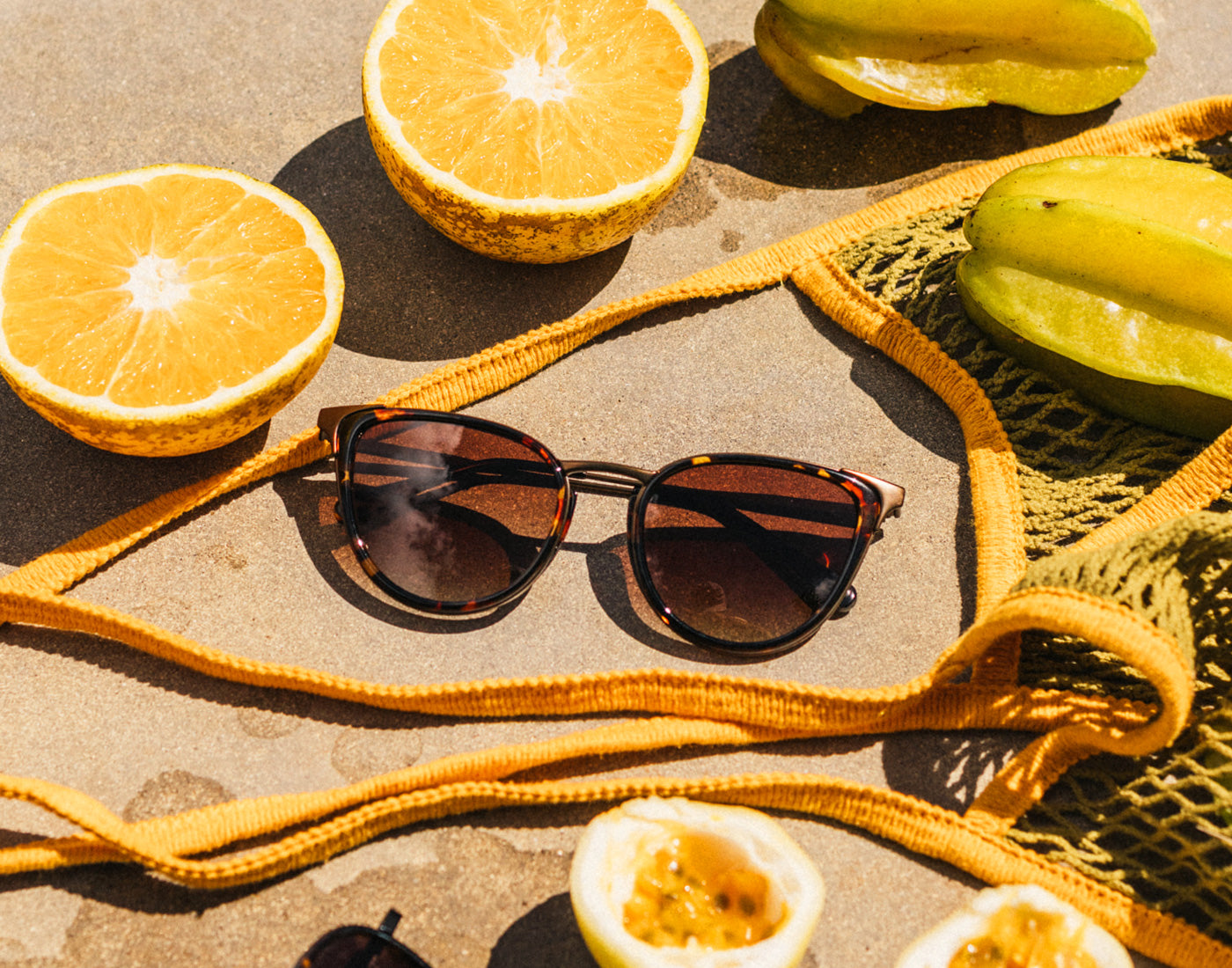 sunski catalina sunglasses next to poolside snacks