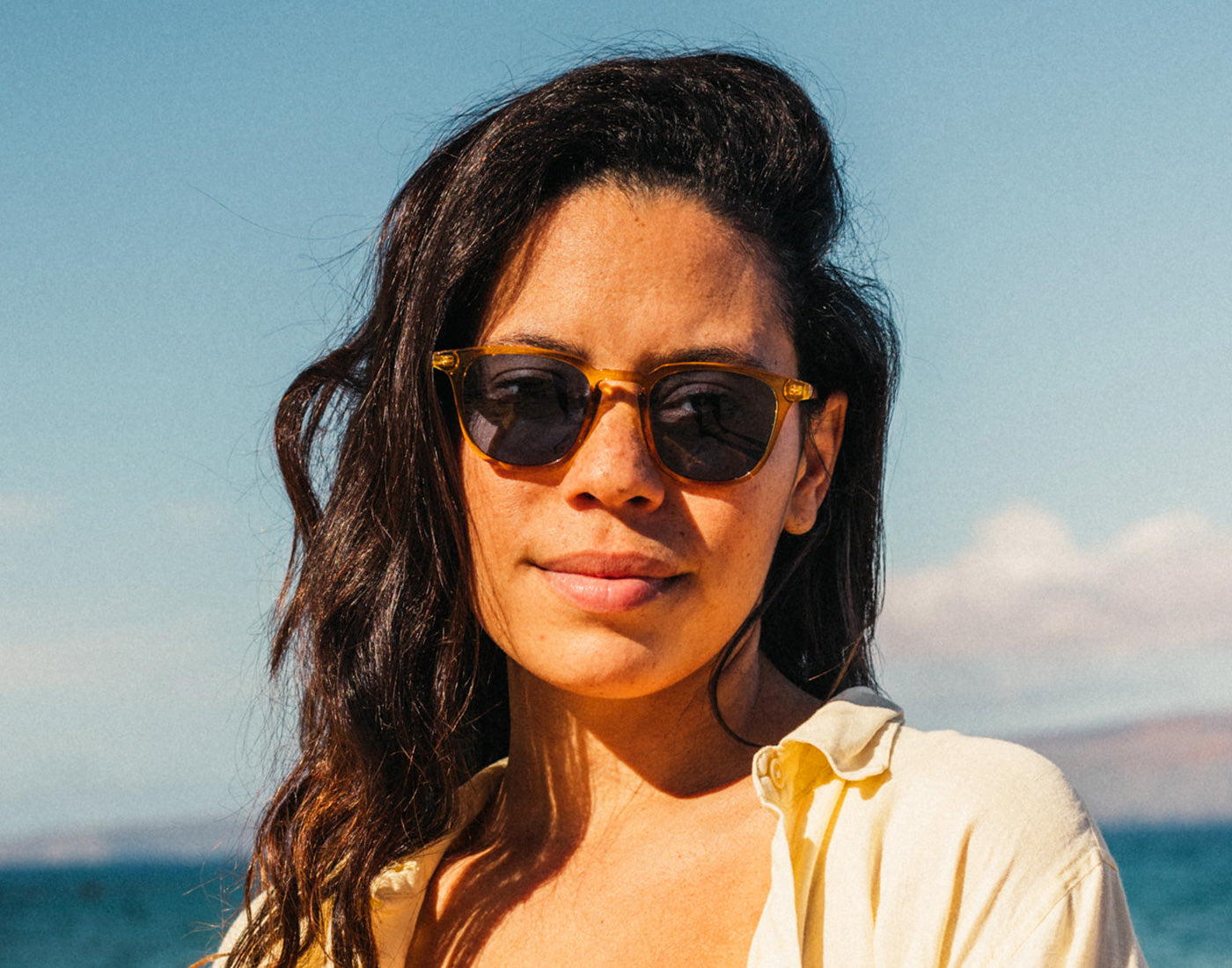 girl looking at the camera wearing sunski tango sunglasses