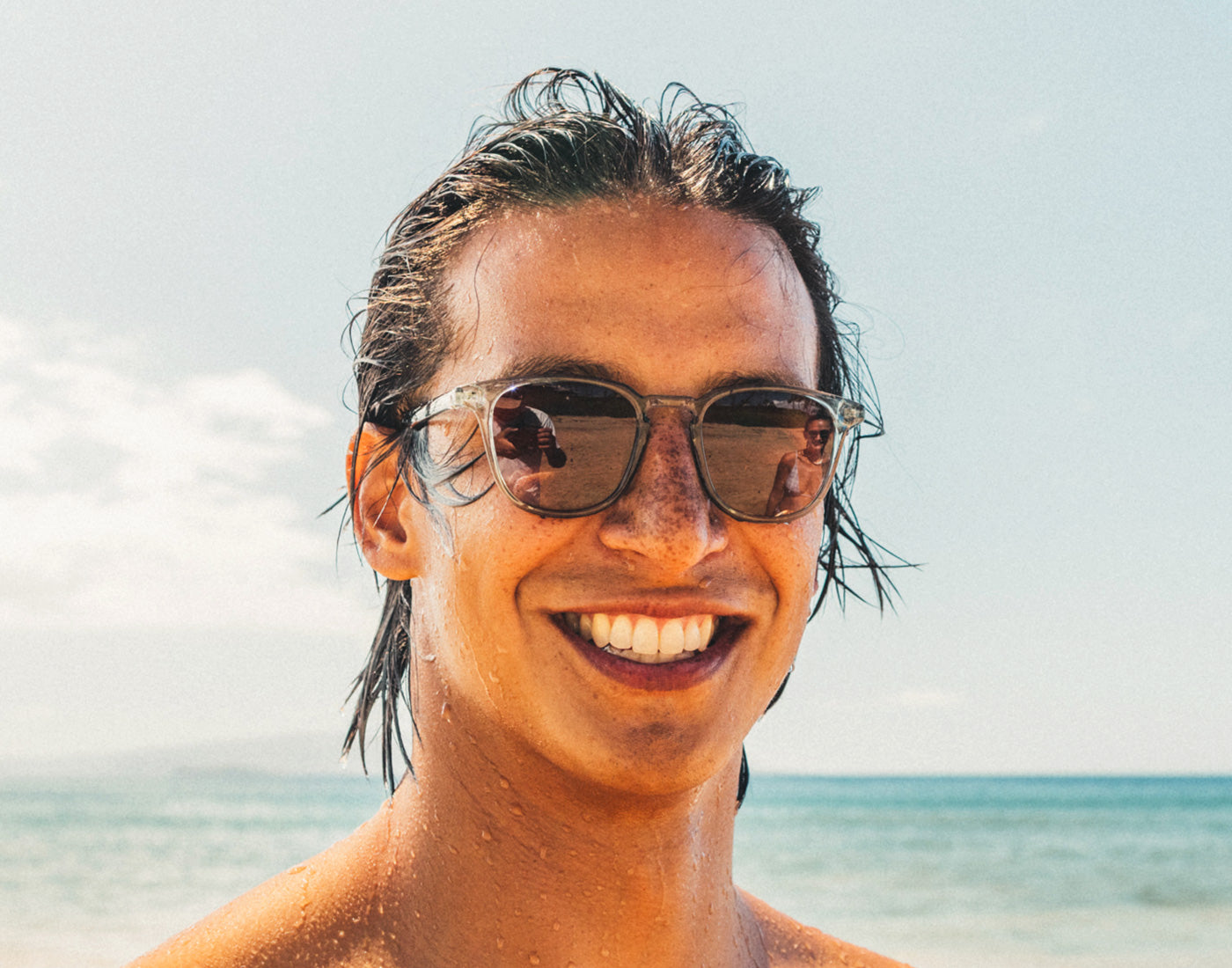 man smiling wearing sunski tango sunglasses