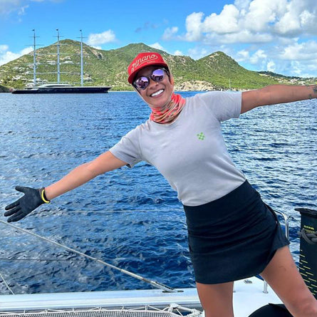 Person on a boat with scenic background