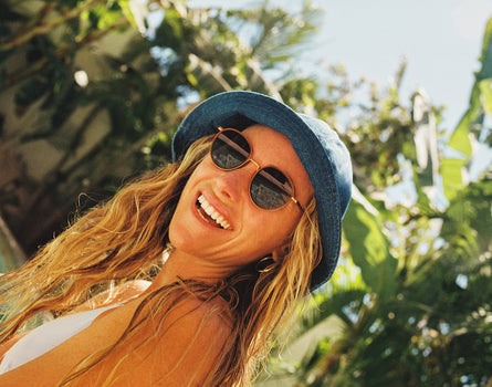 baia tangerine midnight on a woman's face by the pool