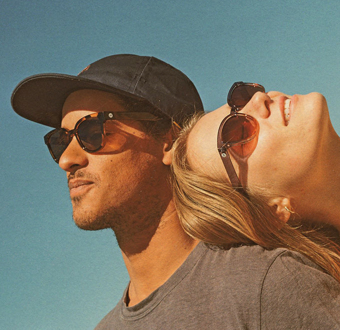 guy and girl in sunski sunglasses