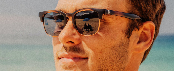 close up profile of man wearing sunski miho sunglasses