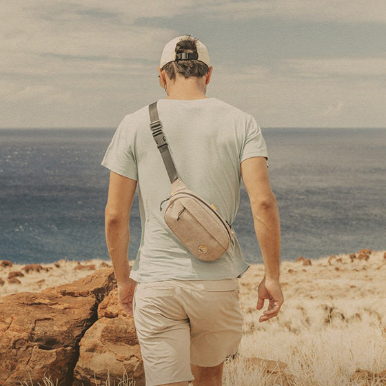 man hiking with sunski sling