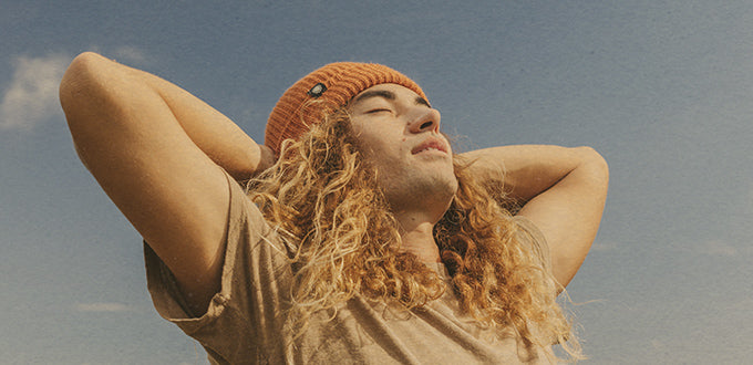 man basking in sunski beanie