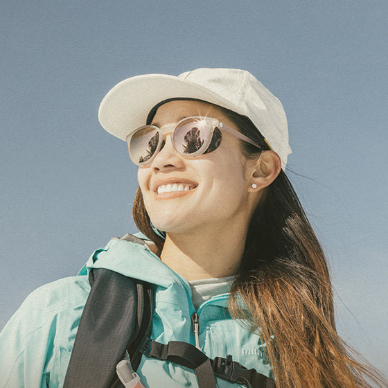 woman wearing sunski mountaineering sunglasses
