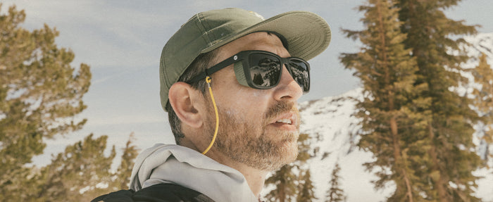 profile of man wearing sunski couloir sunglasses