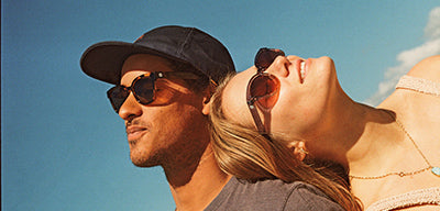 man and woman wearing sunski sunglasses