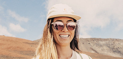 woman in sunski hat and sunglasses in the desert