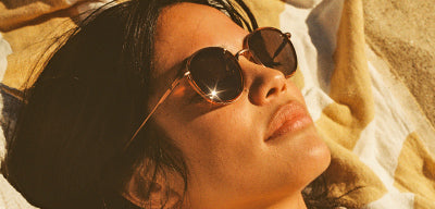 woman in sunski sunglasses at the beach