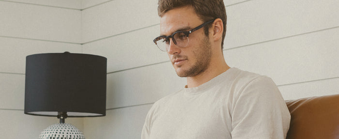 man wearing sunski blue light glasses