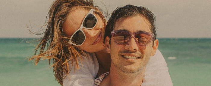 man and woman in sunski sunglasses