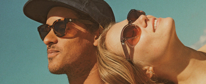 man and woman in sunski sunglasses