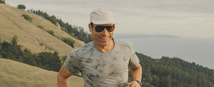 man running wearing sunski polarized sports sunglasses