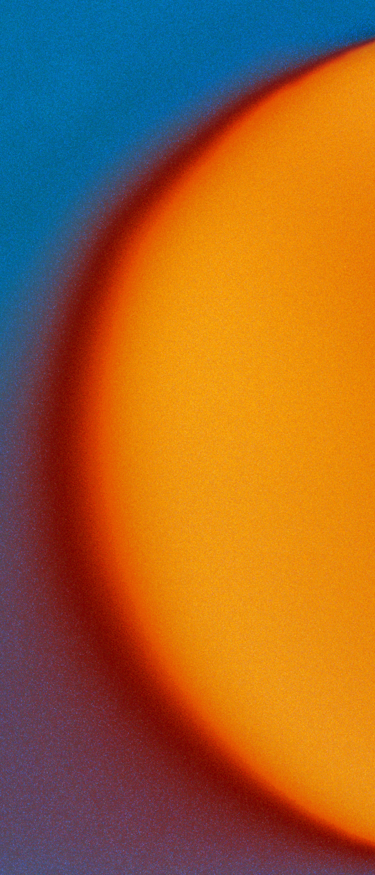 Close-up of a bright orange circle on a blue background
