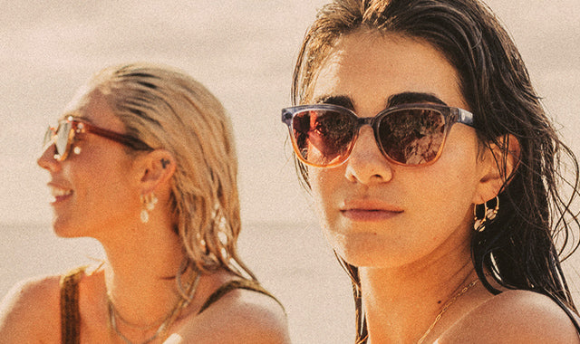 two women in sunski sunglasses at the beach