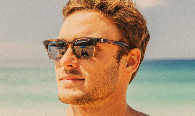 men in sunski sunglasses at the beach