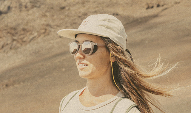 woman hiking with sunglasses retention device