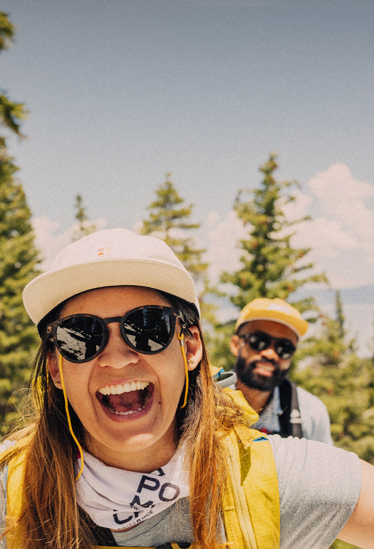 woman and man in sunski sunglasses in the mountains
