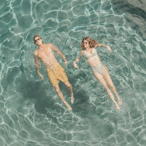 people relaxing in pool in sunskis