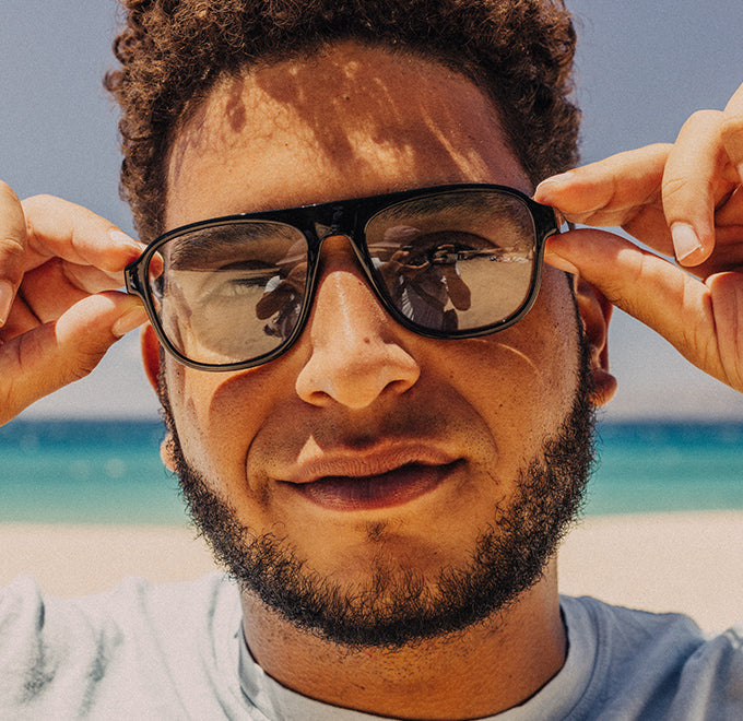 man wearing sunski tinted sunglasses