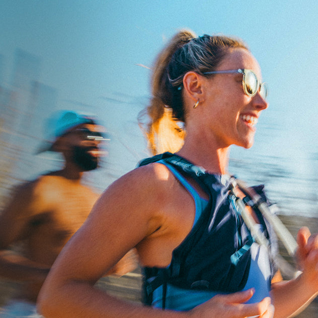 Woman running outdoors with a blurred background