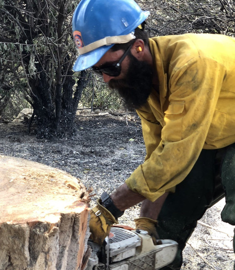 man firefighter in treelines