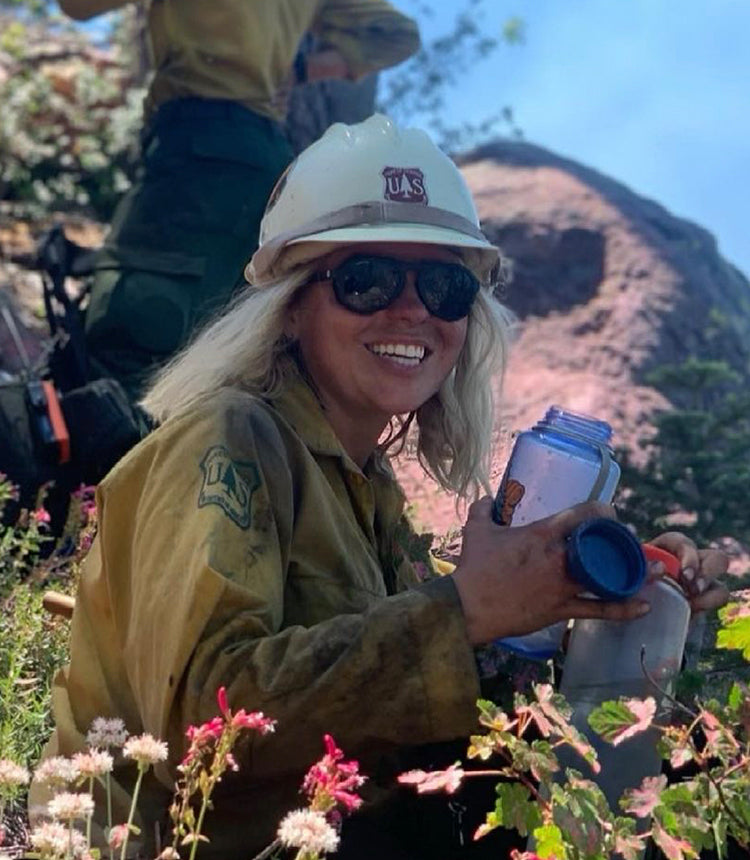 woman firefighter in treelines