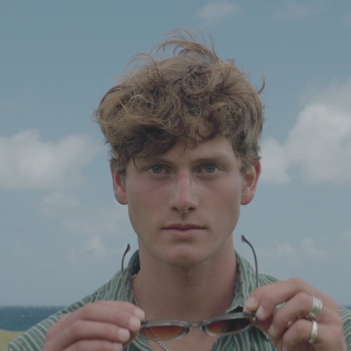 man trying on bianca sunglasses