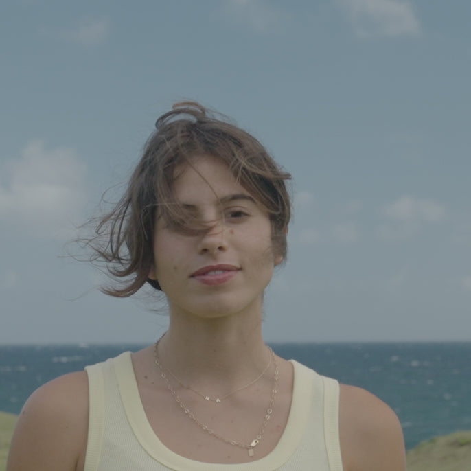 woman trying on lago sunglasses