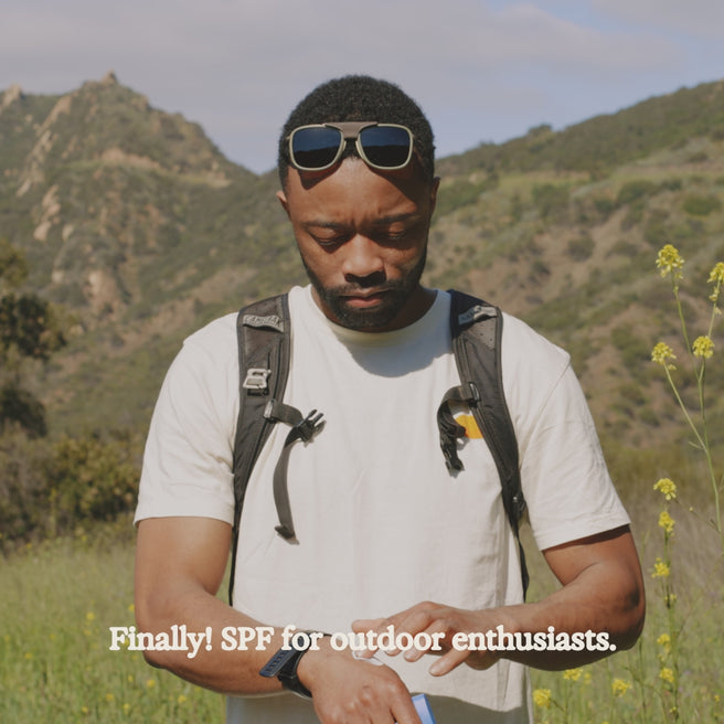 man applying sol power sunscreen