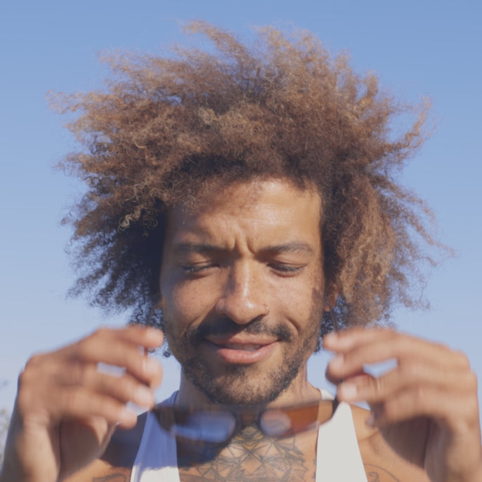 man trying on paladino sunski sunglasses