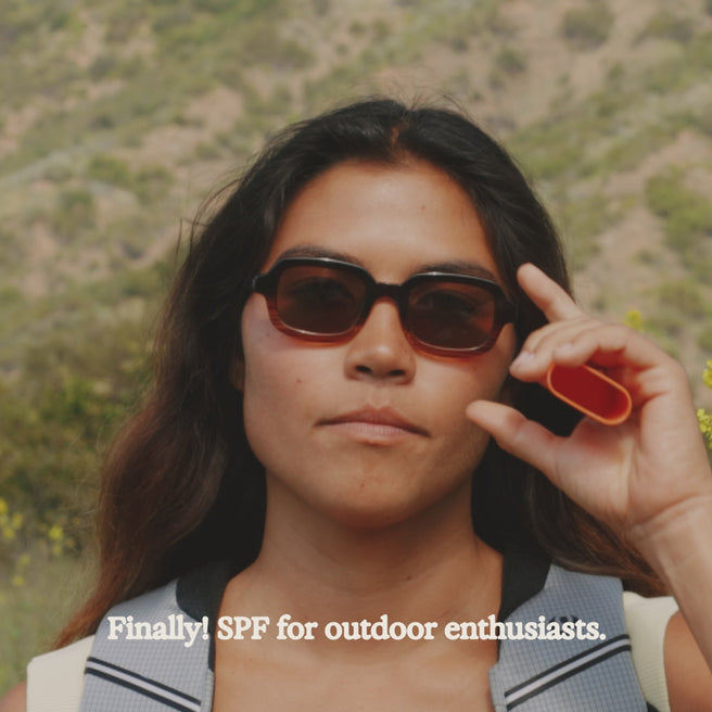 woman applying hot block