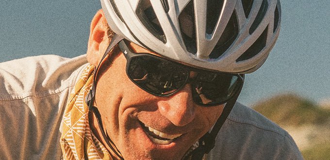 close up of man laughing wearing sunski velo sunglasses