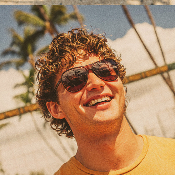 guy smiling wearing sunski polarized sunglasses