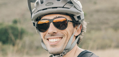 grant cycling in sunski foxtrot sunglasses