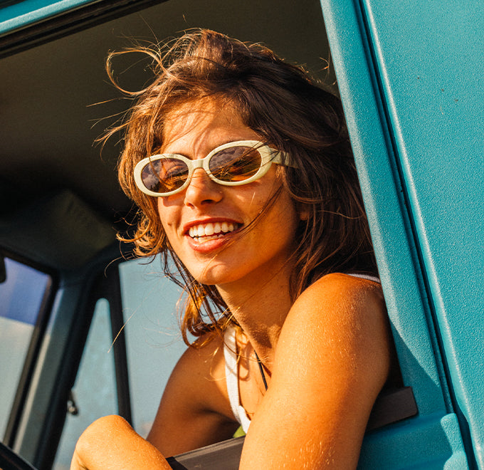 woman in wild eyes sunglasses in a truck