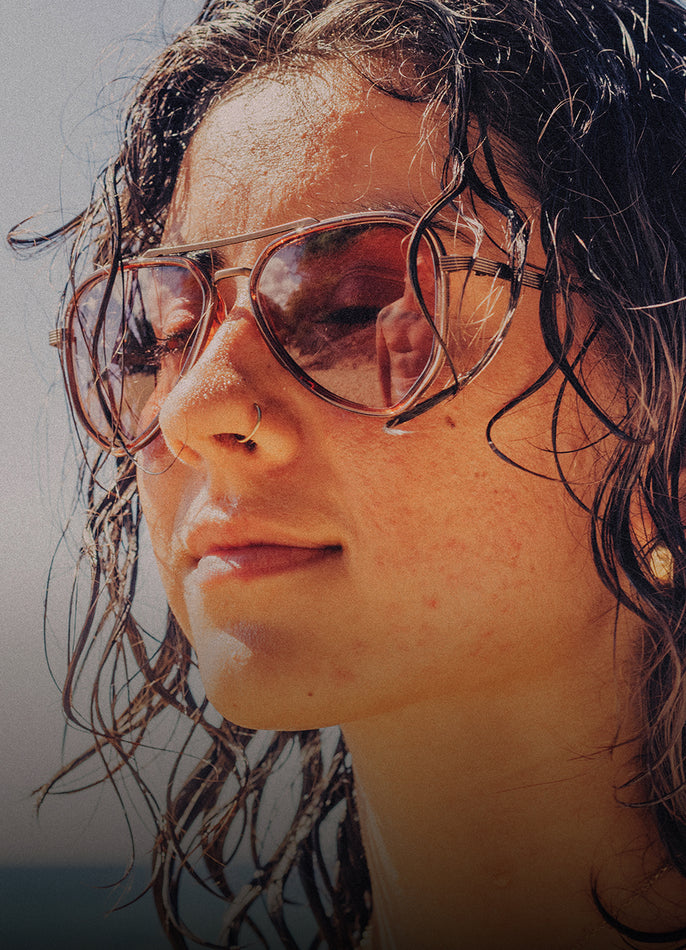 Person wearing sunglasses with a blurred background