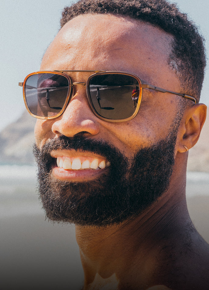 Man wearing sunglasses with a blurred background