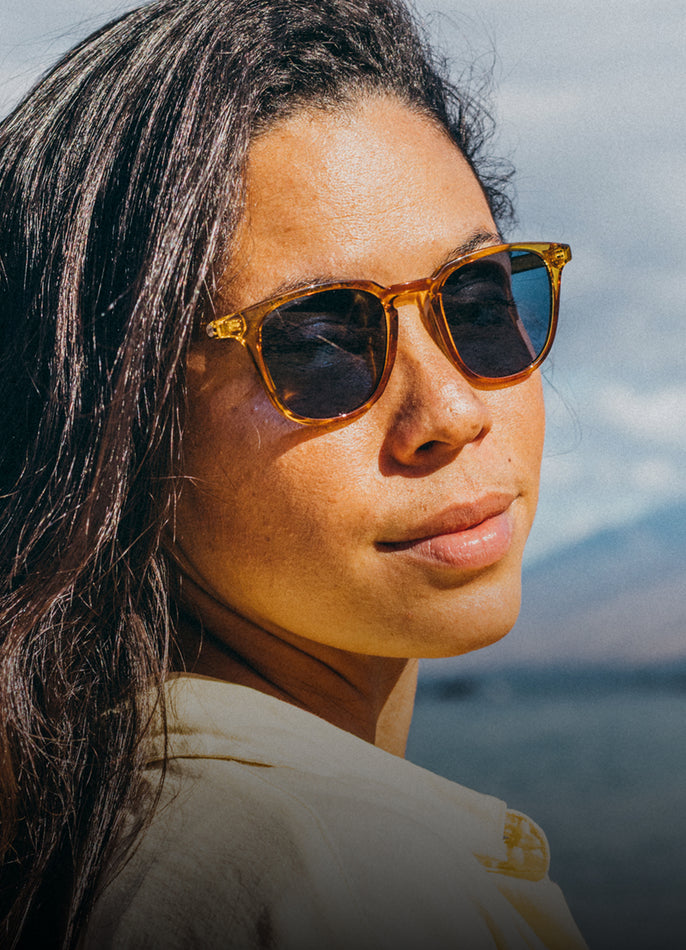 Woman wearing sunglasses with a blurred background