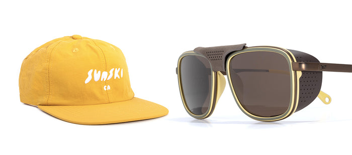 Yellow cap with 'Sunski' logo and sunglasses on a white background