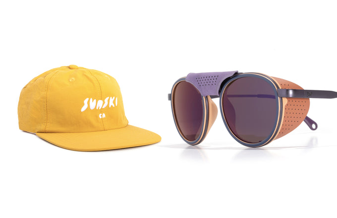 Yellow cap with 'Sunski' logo and a pair of sunglasses on a white background